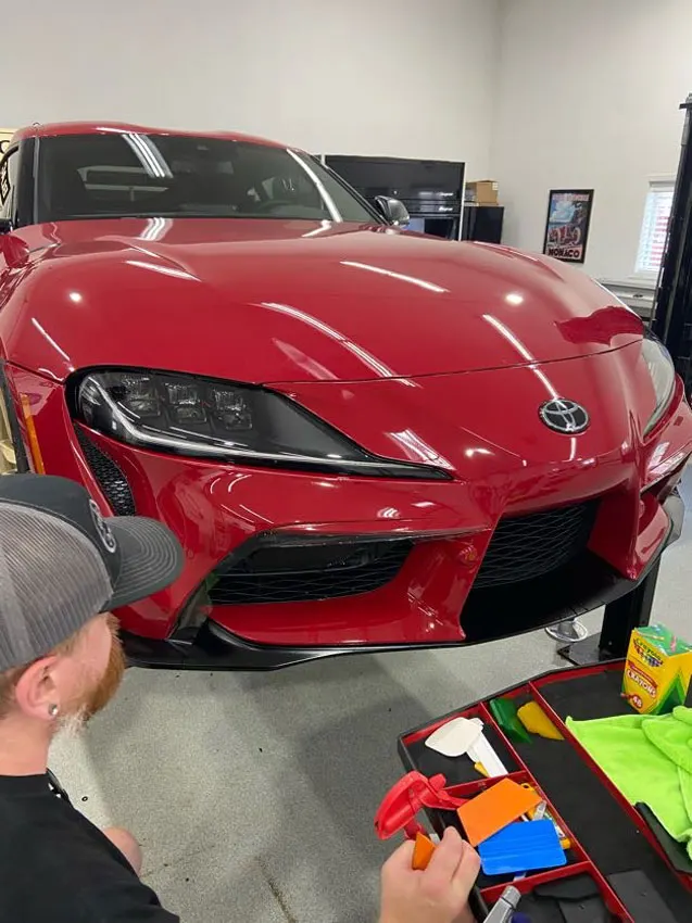 Red Toyota Supra front end ready for PPF
