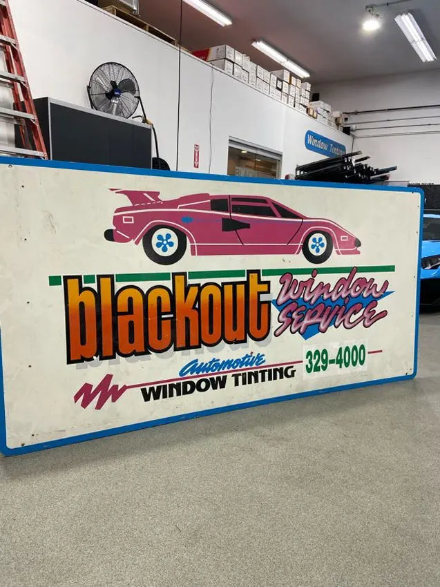Vintage Blackout Window Tinting sign from the early days