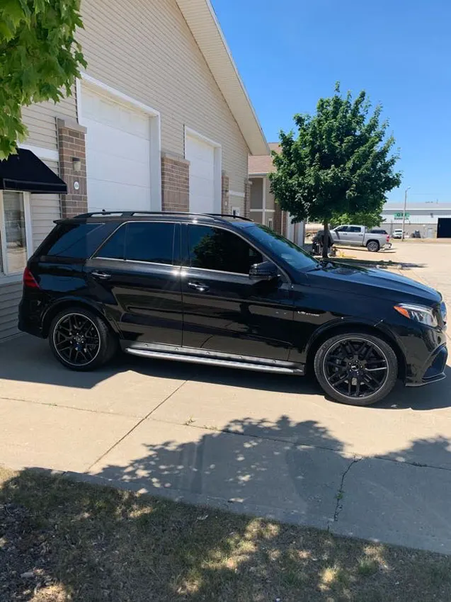 Black Mercedes SUV side profile
